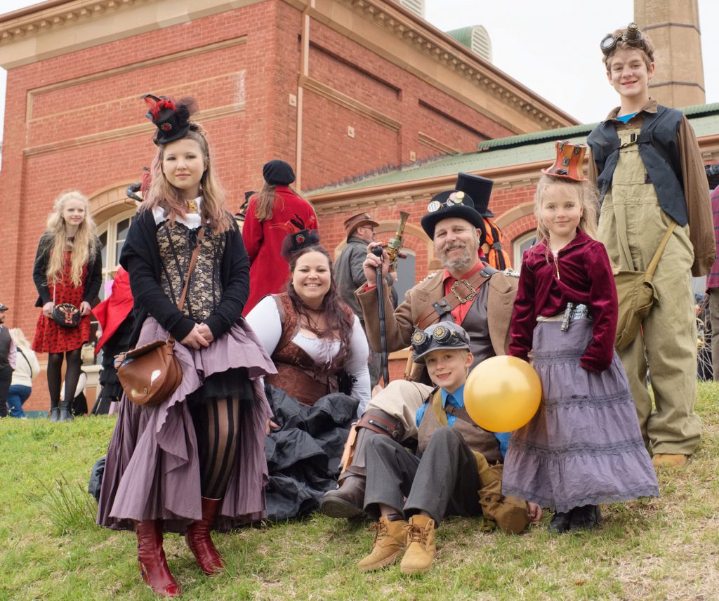 A group of people in steampunk clothing